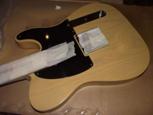 Hardware attached as mask for tinted lacquer