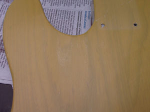 Shiny patches show low spots that are not sanded