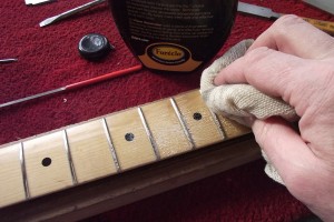 Using Farecla to buff the frets and fretboard