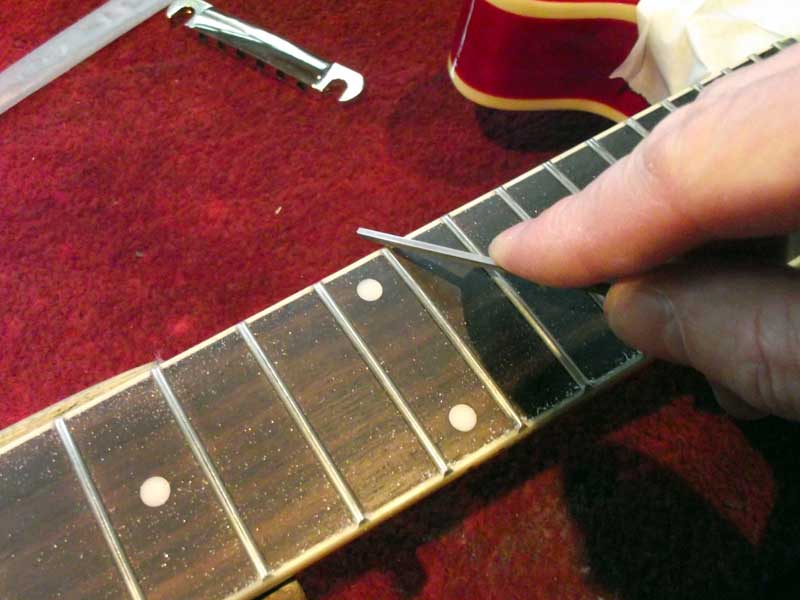 Dressing fret ends with a diamond file